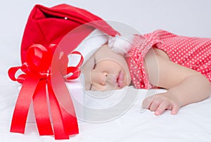 Sleeping baby girl Santa Claus