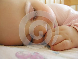 Sleeping baby with hand