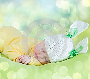 Sleeping baby in hare or rabbit hat