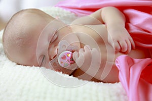 Sleeping baby with pacifier