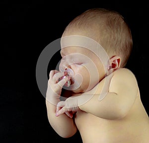 Sleeping baby with pacifier