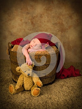 Sleeping baby and teddy bear