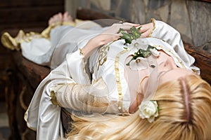 Sleeping beauty lying on the table