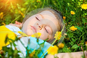 Sleeping boy on grass