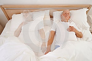 Sleeping, ghost and senior man in bed, depression and ghost of wife or spouse in bedroom. Elderly male person, mental