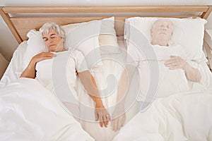 Sleeping, ghost and senior woman in bed, depression and mourning of husband or spouse in bedroom. Elderly female person