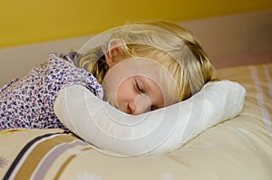 Sleeping girl with bandage