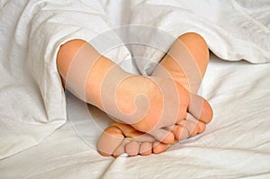 Sleeping girl feet photo