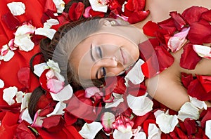 Sleeping girl in rose petal