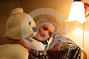 Sleeping girl with Teddy bear toy