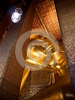 Sleeping golden Buddha statue in Wat Pho Bangkok, Thailand