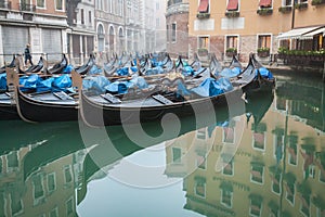 Sleeping Gondolas in Venice with reflection