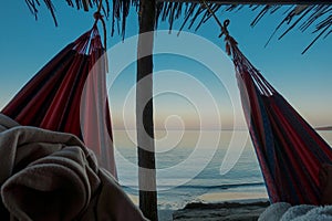 Sleeping in a hammock on Wayuu beach at Cabo de la vela, La guajira, Colombia photo