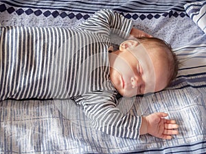 Sleeping happy newborn babe close up