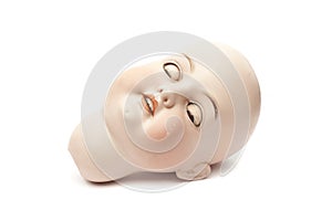 Sleeping head of porcelain doll