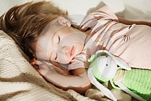 Sleeping little girl. Carefree sleep little baby with a soft toy