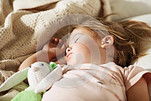 Sleeping little girl. Carefree sleep little baby with a soft toy