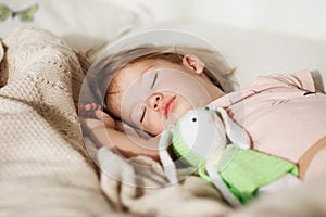 Sleeping little girl. Carefree sleep little baby with a soft toy