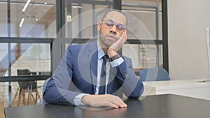 Sleeping Man in Suit Sitting in Office