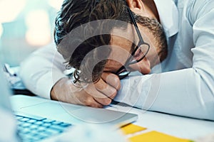 Sleeping, man and tired in office with burnout, fatigue and overworked business employee on desk with glasses, paper and