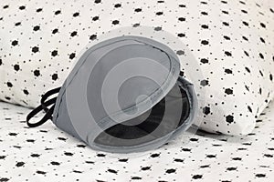 Sleeping mask is on the pillow