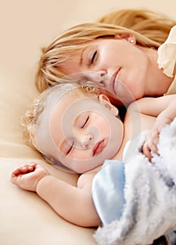 Sleeping, mom and baby with peace in bed together with calm moment with love for infant and kid in morning nap. Mother