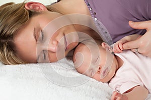 Sleeping mother and baby