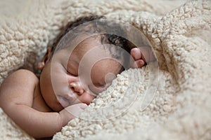 Sleeping newborn baby photo