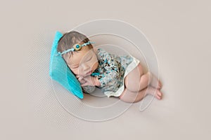 Sleeping newborn baby girl