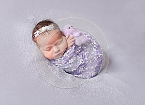 Sleeping newborn baby girl