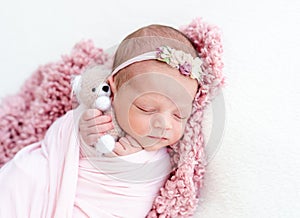 Sleeping newborn baby girl
