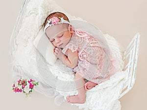 Sleeping newborn baby girl