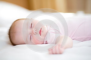 Sleeping newborn baby girl