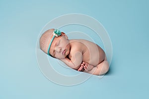 Sleeping Newborn Baby Girl with Blue Rose Headband