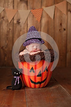 Sleeping Newborn Baby Girl Wearing a Witch Costume