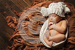 Sleeping Newborn Baby, New Born Kid sleep in Hat, Studio Portrait on Brown