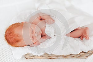 Sleeping newborn baby in a wrap