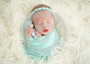 Sleeping newborn in blue headband