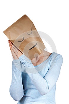 A sleeping paper bag head