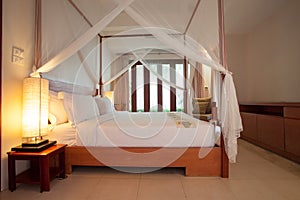 Sleeping room with four-poster bed