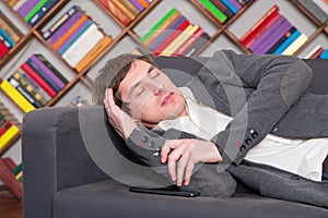 Sleeping student on sofa at library