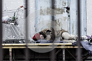 Sleeping tired homeless man