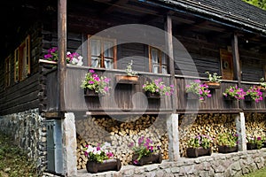 Spania Valley, Slovakia: facade of wooden house in mining village decorated with flowers