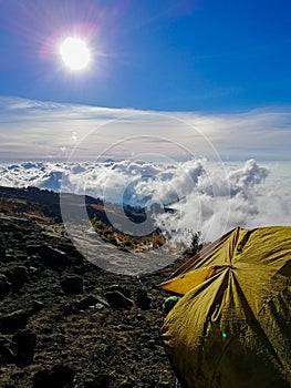 Sleeping on a volcano, waking up above the clouds.