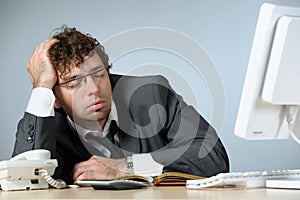 Sleeping young businessman photo