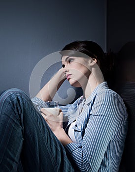 Sleepless woman having a glass of milk