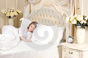 Sleepless woman lying in bed