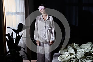 Sleepwalker Standing Next to Window photo