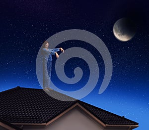 Sleepwalker wearing pajamas on roof in night