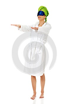 Sleepwalking woman in bathrobe.